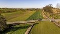 Aerial View of an Amish Horse and Buggy Traveling a Country Road Approaching a Rail Road Crossing Royalty Free Stock Photo