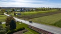 Aerial View of an Amish Pick Up Horse and Buggy Traveling Down a Rural Country Road, Thru Farm Fields on a Sunny Autumn Royalty Free Stock Photo