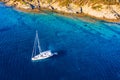 Aerial view of anchored sailing yacht in emerald sea. Aerial view of a boat. Outdoor water sports, yachting. Aerial view of Royalty Free Stock Photo