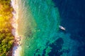 Aerial view of anchored sailing yacht in emerald sea. Aerial view of a boat. Outdoor water sports, yachting. Aerial view of Royalty Free Stock Photo