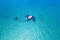 Aerial view of anchored sailing yacht in emerald sea. Aerial view of a boat. Outdoor water sports, yachting. Aerial view of Royalty Free Stock Photo