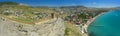 Aerial view on ancient stone castle on the top of the stone rock with city, blue sea and mountains in the background. Cenevez Qaya Royalty Free Stock Photo