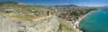 Aerial view on ancient stone castle on the top of the stone rock with city, blue sea and mountains in the background. Cenevez Qaya Royalty Free Stock Photo