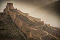 Aerial view of an ancient structure in Aragon, Spain with fog all around it Royalty Free Stock Photo