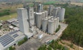Aerial view of animal feed factory. Agricultural silos, grain storage silos, and solar panel on roofs of industrial plants. Royalty Free Stock Photo
