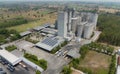 Aerial view of animal feed factory. Agricultural silos, grain storage silos, and solar panel on roofs of industrial plants. Royalty Free Stock Photo