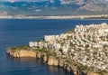 Aerial view of Antalya and Falezler. Coast, buildings and sea from the airplane window.