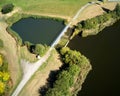 Aerial view of the antechamber of a rainwater retention basin with a green area