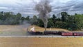 Aerial View of 2 Antique Norfolk and Western Steam Engines No. 611 and 382 Double Heading a Freight Train with Black Smoke and