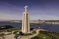 Aerial view of April 25th bridge and Cristo Rei Christ the King at sunset over the Tagus river, Almada, Lisbon, Portugal Royalty Free Stock Photo