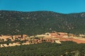 arable land ready for sowing in the middle of a forest in the Mediterranean area Royalty Free Stock Photo