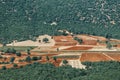 View of arable land ready for sowing in the middle of a forest in the Mediterranean area Royalty Free Stock Photo