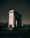 Aerial view of Arch of Triumph in Bucharest surrounded by cars