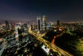 Aerial view of Architecture details Modern Building Glass facade Business background at night. Jakarta, Indonesia, September 23,