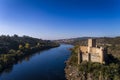 Aerial view of the Armourol Castle with a boat passing in the Tagus River in Portugal Royalty Free Stock Photo