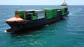 Aerial view of the arrival in the vicinity of the port of Alicante, the container ship JSP Rover.