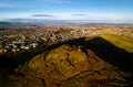 Aerial view of Arthurs seat with the Old city of Edinburgh on the background Royalty Free Stock Photo