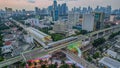 Aerial view of articulated city buses arriving and leaving at bus station near main railway station MRT line at Kebayoran Baru.