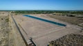 Aerial view of artificial water reservoir for agricultural irrigation Royalty Free Stock Photo