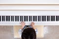 Aerial view of Asian Chinese little boy playing piano Royalty Free Stock Photo