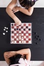 Aerial view of Asian Chinese little sisters playing chess together Royalty Free Stock Photo