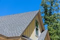 Aerial view the asphalt shingles roofing construction waterproofing for new house in covered corner roof shingles Royalty Free Stock Photo