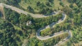 Aerial view of asphalt winding road in the forest mountain for background.Scenic view of Sharp curve road by drone safty drive and Royalty Free Stock Photo