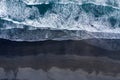 Aerial view of Atlantic ocean waves washing black sandy beach Royalty Free Stock Photo