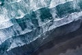 Aerial view of Atlantic ocean waves washing black sandy beach Royalty Free Stock Photo