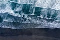 Aerial view of Atlantic ocean waves washing black sandy beach Royalty Free Stock Photo