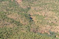 Aerial view of Australian bush comprising scattered scrub and trees directly below. Royalty Free Stock Photo