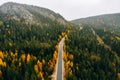 Aerial view of autumn color forest in the mountains and a road with car in Finland Lapland Royalty Free Stock Photo
