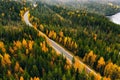 Aerial view of autumn color forest in the mountains and a road with car in Finland Lapland Royalty Free Stock Photo