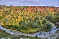 Aerial view of the autumn forest and blue river. Colorful aerial landscape Royalty Free Stock Photo