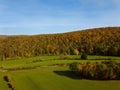 Aerial view of autumn forest. Fall landscape with red, yellow and green foliage on a sunny October day Royalty Free Stock Photo