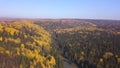 Aerial view of autumn forest and small lake. Clip. Breathtaking panoramic aerial view of the hills of colorful orange Royalty Free Stock Photo