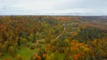 Aerial View of Autumn Landscape View of the Autumn Bright Multi-colored Trees, Green, Orange and Reddish Tint. Royalty Free Stock Photo