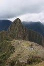 An aerial view of the back section of Machu Picchu, including farming terraces, rock quarry, the main temple, Intihuatana