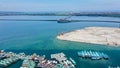 Aerial view of Bali Mandara toll road over sea. Car, motorbike bridge across the Gulf of Benoa connecting Denpasar city