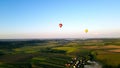 Aerial view Balloons arriving at sunset in a picturesque area. V