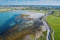 Aerial view on Ballyloughane Strand in Galway city, Ireland. High tide. Blue cloudy sky and ocean water. Popular area with amazing Royalty Free Stock Photo