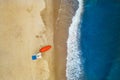 Aerial view of Baltic Sea shoreline with waves crushing sand beach during sunrise in the morning, lifeguard post and boat, drone Royalty Free Stock Photo