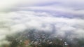 Aerial view of Bao Loc cityscape at morning with misty sky in Vietnam highlands