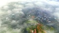 Aerial view of Bao Loc cityscape at morning with misty sky in Vietnam highlands