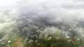 Aerial view of Bao Loc cityscape at morning with misty sky in Vietnam highlands