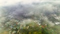 Aerial view of Bao Loc cityscape at morning with misty sky in Vietnam highlands