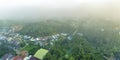 Aerial view of Bao Loc cityscape at morning with misty sky in Vietnam highlands