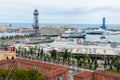 Aerial view of Barcelona cruise port terminals with docked cruise ships from Montjuic hill. Port Vell Aerial Tramway cabin with