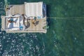 Aerial view of barge boat in the ocean. People relaxing on barge in the ocean. Royalty Free Stock Photo