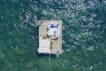 Aerial view of barge boat in the ocean. People relaxing on barge in the ocean. Royalty Free Stock Photo